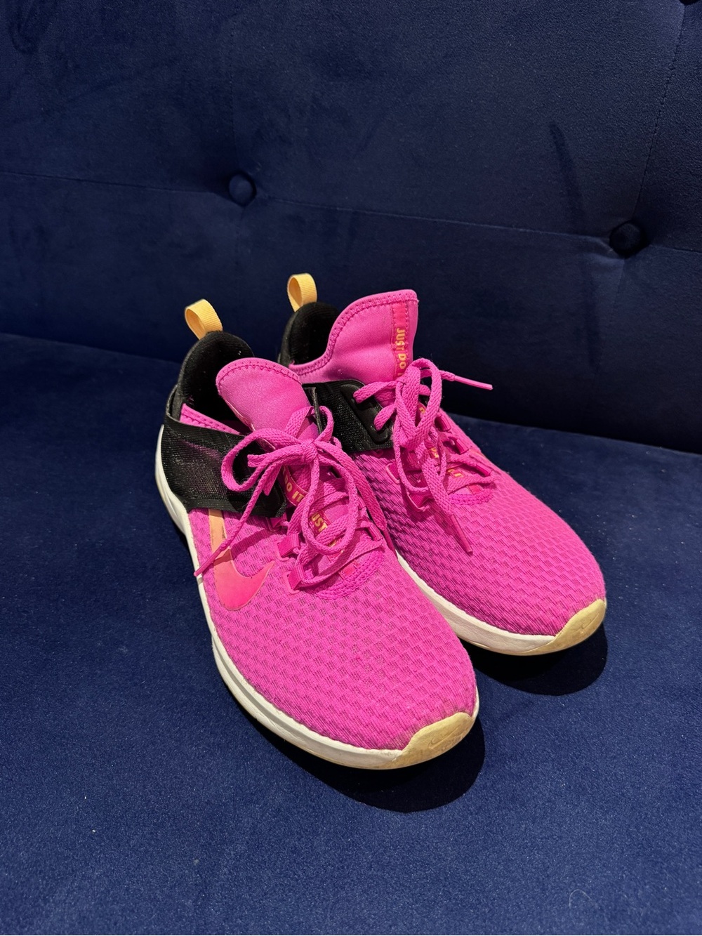 Nike Women’s Bright Pink Athletic Sneakers with Black and Yellow Accents
